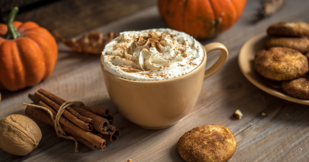 pumpkin spice latte surrounded by fall autumn decor