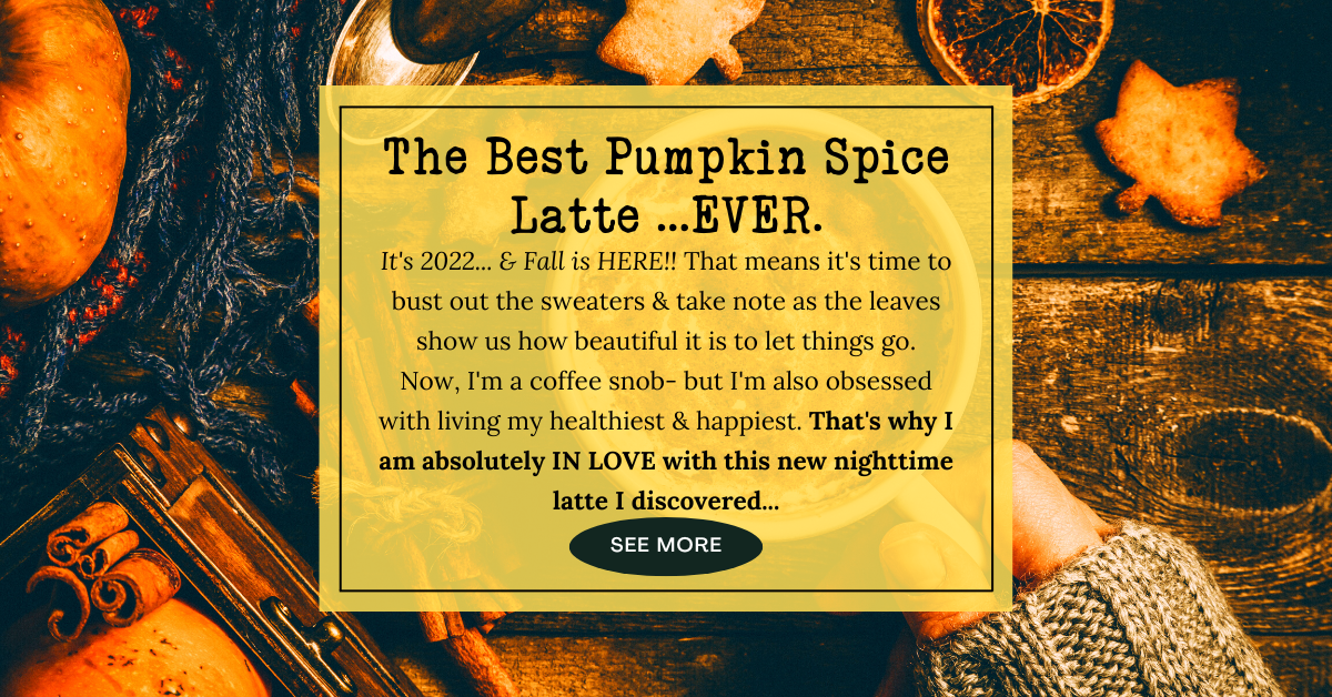 woman's hand holding a pumpkin spice latte surrounded by fall autumn decor